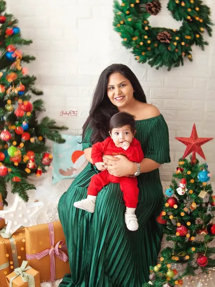A beautiful mother and son portrait from our Christmas mini-sessions. The festive background adds a touch of holiday magic to this sweet family moment.