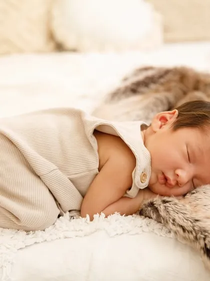 Curled up on a soft, furry blanket, this baby is deep in dreamland. My goal is to create a comfortable and warm environment so your newborn can sleep soundly through their session.