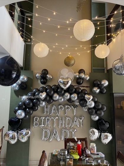 Another angle of the heartwarming birthday decoration for a dad, with hanging lanterns creating a warm glow.