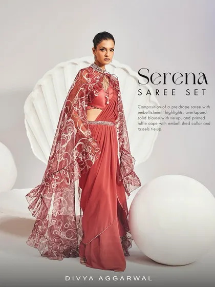 The Serena Saree Set offers a majestic presence. I combined a pre-draped saree with a dramatic printed ruffle cape and an embellished collar, creating a look of palatial finesse for your most important events.