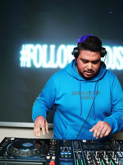 Mixing in front of my custom "#FOLLOWTHEDJSAU" visuals. It's all about building a complete brand experience.
