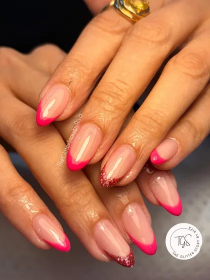 Who says a French manicure has to be boring? I gave this classic a fun twist with a vibrant hot pink tip and a surprise glitter accent nail. It's all about making the style your own.