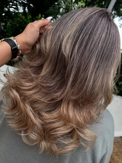 Another look at my 'Vanilla Butter Cream' creation. This is a fantastic way to blend grey hair into a stylish, modern blonde look. The ash tones help neutralize any brassiness for a cool, creamy finish.