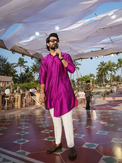 A full-length view of my purple kurta look against the backdrop of a beautiful Goa venue.