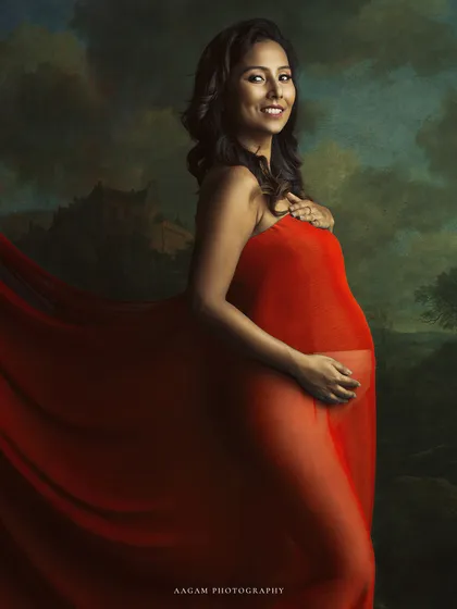 Wrapped in a flowing red gown, you are a masterpiece of strength and beauty. My fine art sessions are designed to feel like a painting, capturing your elegance against a classic, artistic backdrop.
