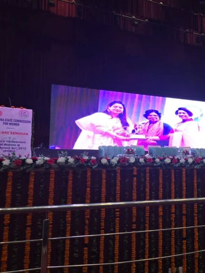 A view of the stage from the audience. It's inspiring to see large-scale events dedicated to women's rights and legal awareness.