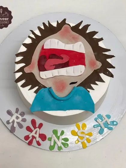 A Horrid Henry theme cake that perfectly captures his mischievous expression. This chocolate mousse cake uses minimal fondant to create the character's face for a fun and unique design.