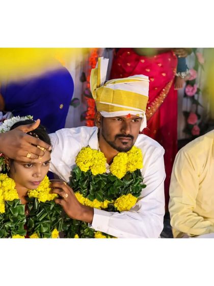 A candid moment during the wedding ceremony. The groom blesses his bride, a quiet and meaningful gesture that I love to capture. These are the unposed moments that tell the real story of your day.
