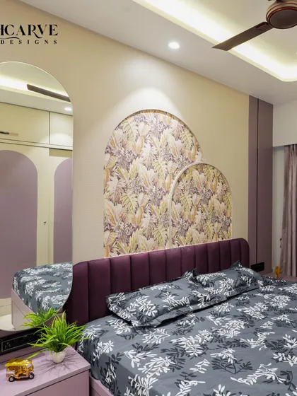 A close-up of the headboard area, with its layered arched panels and rich textures.