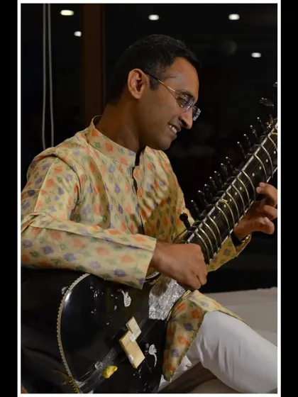 Another angle from an intimate concert, showing my engagement with the music and the serene environment.