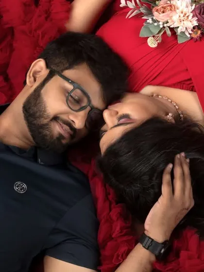 A tender moment between partners, captured from a unique overhead perspective. This sleeping pose is perfect for showcasing the couple's connection in a peaceful, intimate way.