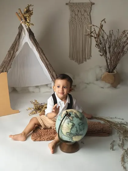 This little globetrotter is ready for an adventure. For his first birthday, we created a boho explorer theme complete with a vintage globe and a teepee tent.