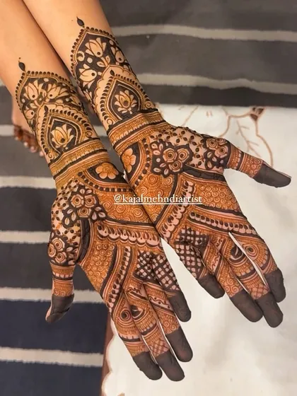 This non-figurative Indian henna design is rich with traditional patterns, including paisleys, florals, and delicate dot work.