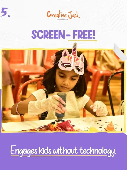 Highlighting the benefit of a screen-free activity, this image shows a girl in a unicorn mask engrossed in her craft, fully engaged without any technology.