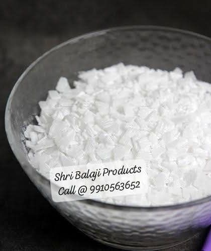 A bowl of caustic soda flakes, also known as lye. This is a key component in the saponification process for creating traditional bar soaps. Please handle with care.