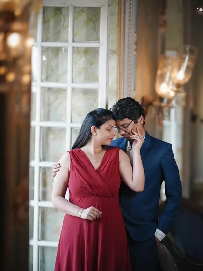 An intimate portrait using the soft window light in a heritage building. The warm lighting and elegant setting create a timeless and romantic mood.