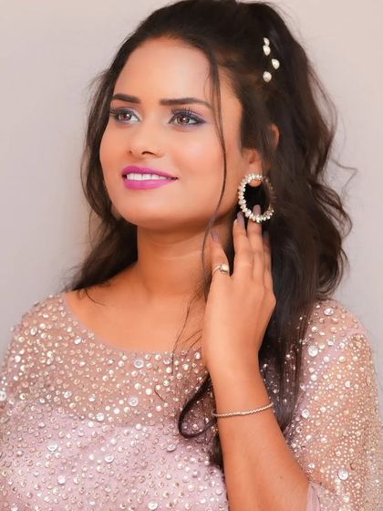 A lovely pink poncho style gown that is both stylish and comfortable. The pearl and crystal work adds a touch of sparkle, perfect for a party.