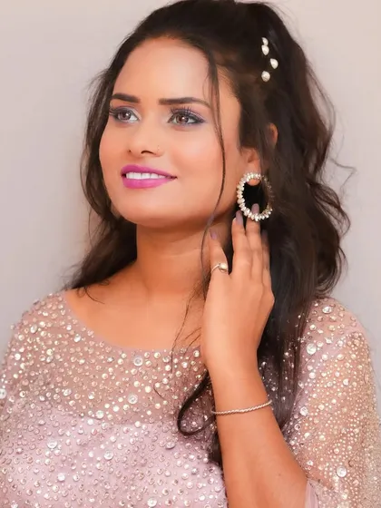 A lovely pink poncho style gown that is both stylish and comfortable. The pearl and crystal work adds a touch of sparkle, perfect for a party.