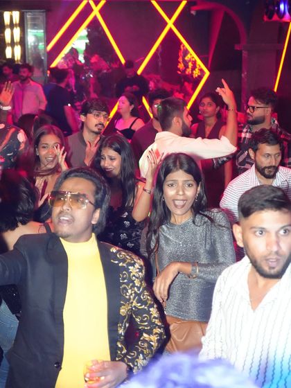 The dance floor at Mirror Nightclub is packed with people enjoying the launch party, their faces lit with excitement.