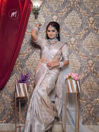 A graceful pose against a damask wallpaper, adding to the regal feel of the look.