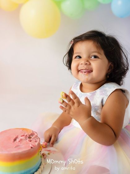 A fun cake smash photo, demonstrating how to capture milestone moments with energy and color.