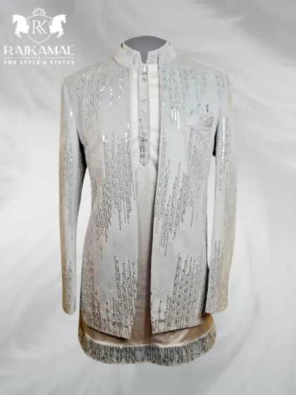 A full view of this shimmering white Indo-Western outfit. The jacket is heavily embellished with sequins, creating a dazzling effect perfect for a Sangeet or reception.