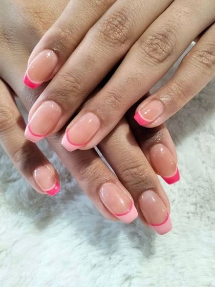 A soft and pretty take on the French manicure, with short, rounded nails and a lovely bright pink tip.