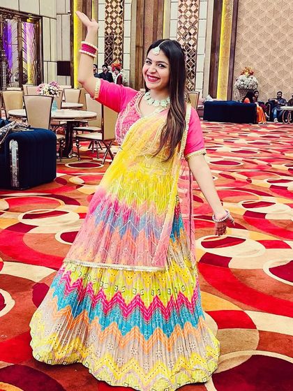 Twirling in this vibrant, multi-colored lehenga at an office Diwali party. This is a rental piece, which is a great hack for wearing gorgeous, heavy outfits without buying them.