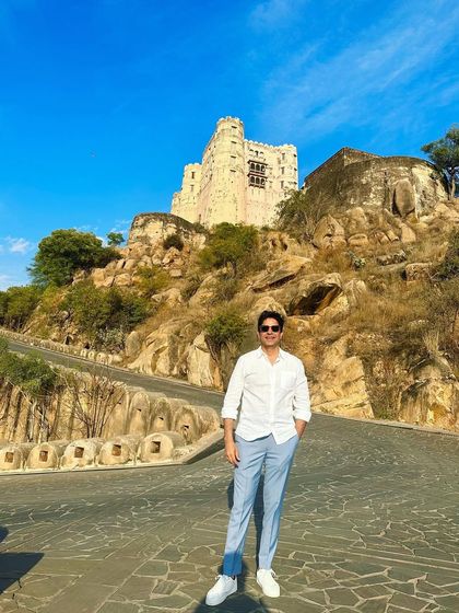 A full-length shot against the backdrop of a fort on a hill. It showcases the epic scale of the locations I work in.