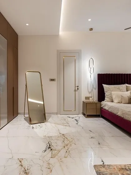 Another view of the master bedroom, highlighting the fluted glass wardrobe and the elegant proportions of our custom bed.
