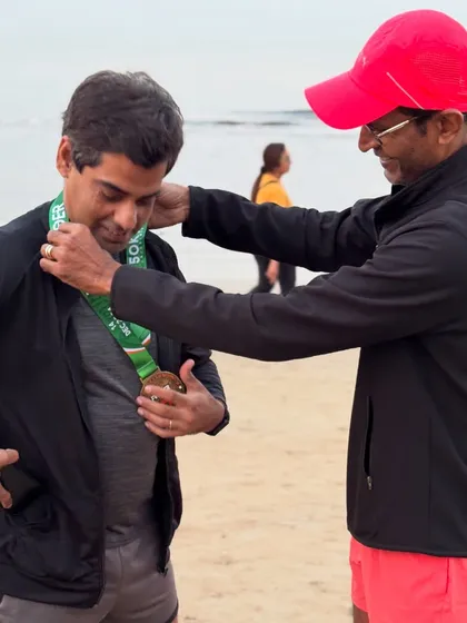 A proud moment as coach awards the medal to Rajesh Sharma for completing one of the toughest 50km races.