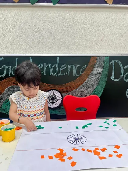 Another one of our little caterpillars absorbed in our Independence Day craft session. These activities are designed to be both educational and enjoyable for our youngest learners.