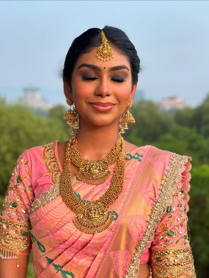 Another beautiful shot with her eyes closed, highlighting the perfect makeup application.