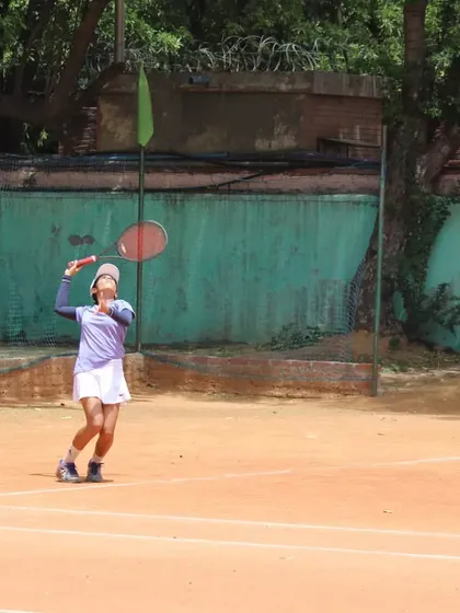 A player hitting an overhead smash. We ensure our players are comfortable and confident with every shot in the book.