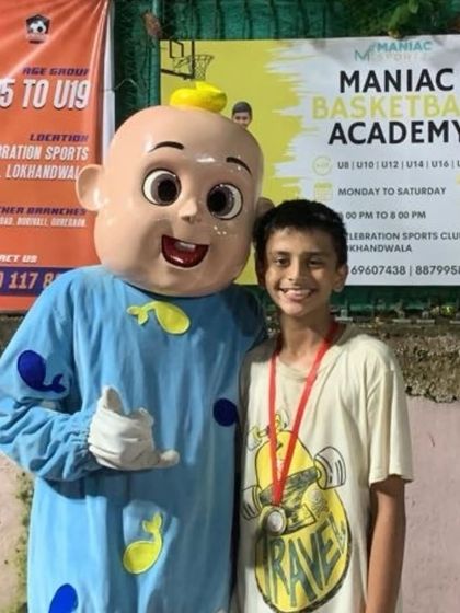 All smiles and cheers with a friendly mascot at "The Carnival." Our events are about bringing the community together for fun and basketball.
