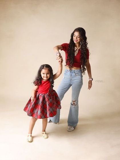 A mother and daughter, hand in hand. This portrait captures the beginning of a lifelong friendship.