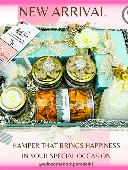 A new arrival that brings happiness to your special occasion. This hamper is overflowing with treats in a beautiful teal-colored tray, finished with white flowers and elegant bows.