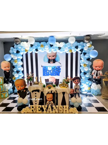 I can execute any theme you can imagine, like this fun Boss Baby birthday party. The setup features a checkerboard floor, character cutouts, and a black, white, and blue balloon arch for a sharp and playful look.