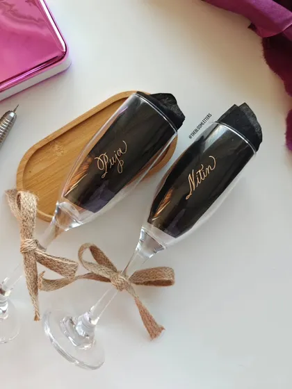 Celebrate your moments with a personal touch. These hand engraved champagne glasses for 'Puja' and 'Nitin' are a timeless way to honor life's most beautiful milestones, turning a simple glass into a cherished memory.