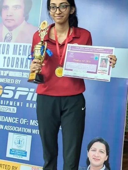 Our star player Vidhi Shah with her winner's trophy for the U-19 category at the state ranking tournament. Her victory was well-deserved after a series of dominant performances.