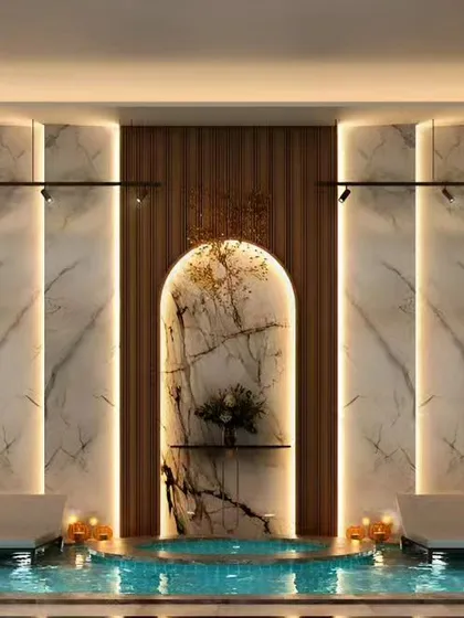 This luxury spa and wellness center was designed as a tranquil escape. We used large format marble slabs with integrated backlighting, a central water feature, and warm, ambient light to create a serene and deeply relaxing environment for guests.