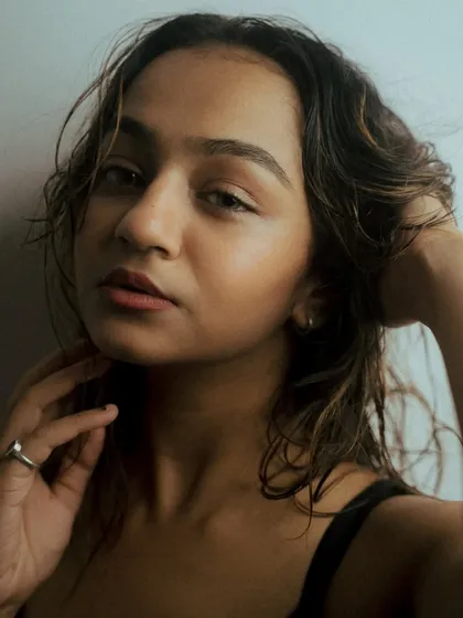 A series of creative headshots using glass and other objects in front of the lens to create distortion and blur. This technique adds an artistic, abstract layer to the portraits.