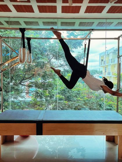 Courage is the first step. This flying pose on the Cadillac is a leap of faith that builds strength and confidence.