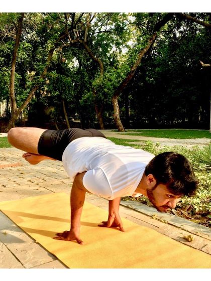 Here is another perspective on Mayurasana (Peacock Pose) in a natural setting. This pose is a testament to the power of a dedicated practice, building incredible strength in the arms, wrists, and abdomen.