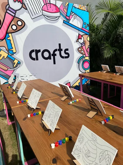 Our dedicated crafts table, all set up for a party with canvases, paints, and brushes ready for the young artists.