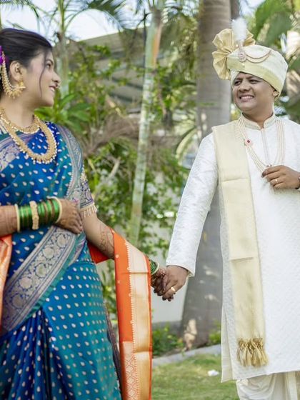 A classic walking portrait, with the couple holding hands and sharing a happy glance.