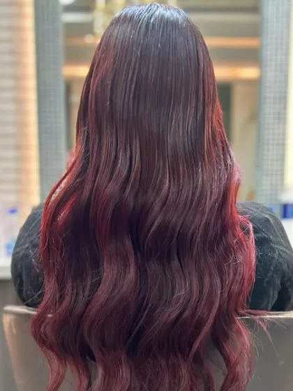 The back view of this red ombre shows the length and health of the hair. The color is rich and saturated, proving that bold color can also look incredibly luxe.