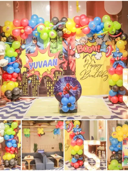 Another look at a fantastic superhero birthday bash! The party featured a huge light-up number 5 and a city skyline backdrop for our little hero, Yuvaan.