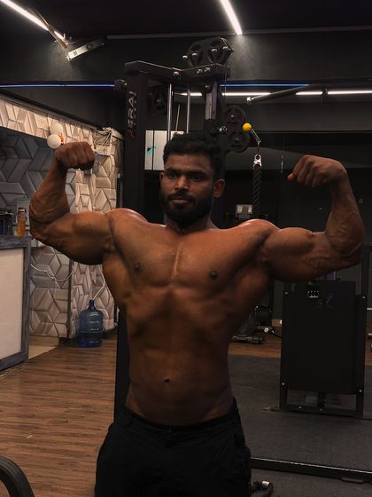 Another shot of the front double bicep, highlighting the peak of the biceps and the overall upper body mass.