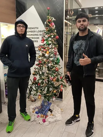 Two members enjoying the festive atmosphere during our Christmas celebration at the club.